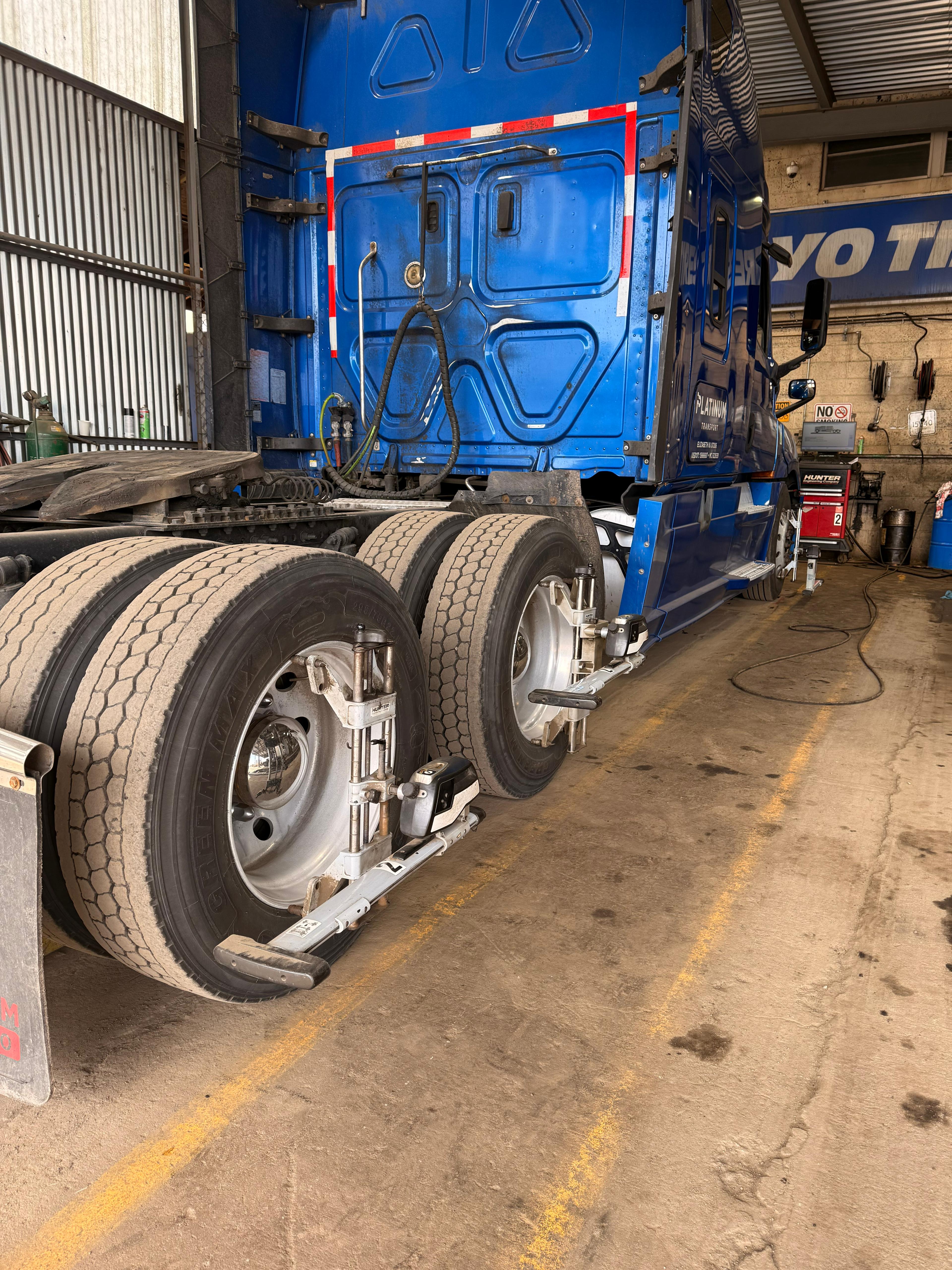 Truck positioned inside Somet Truck Center for alignment service